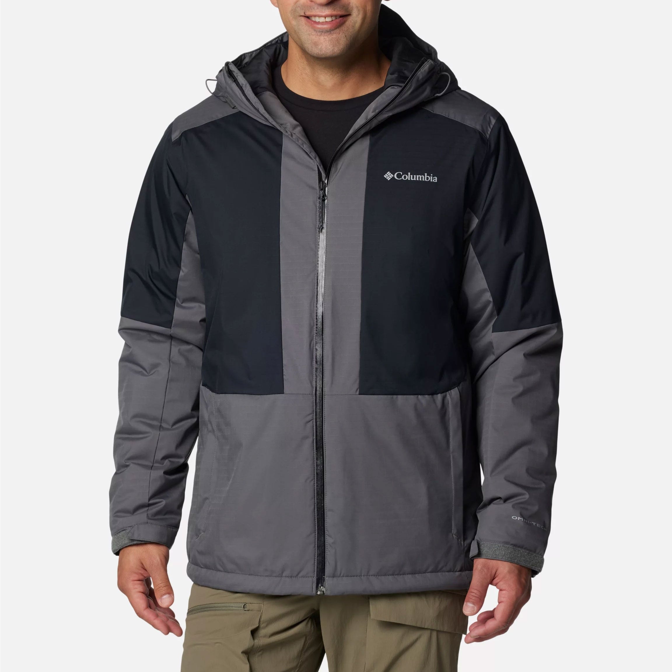 Man wearing a Columbia jacket on a white background